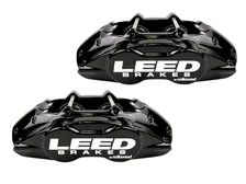 Front New fully tested loaded caliper with stainless steel pistons black powder coated pair image 2